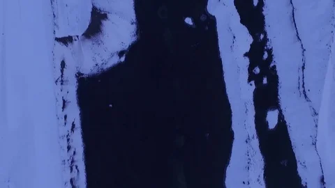 Aerial top view of ice river bed in Iceland Stock Footage 82879438