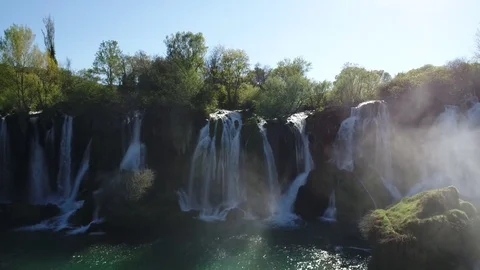 Aerial top view of an impressive waterfall in the background Stock Footage 74536168