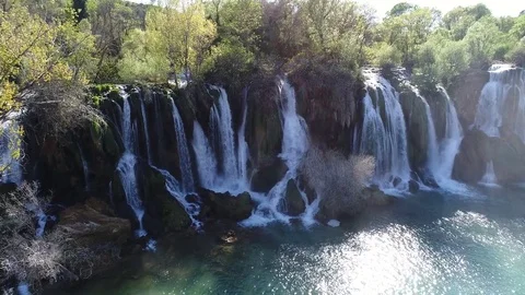 Aerial top view of an impressive waterfall in the background Stock Footage 74537159