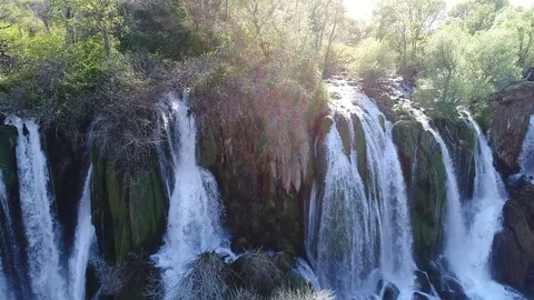 Aerial top view of an impressive waterfall in the background Stock Footage 74538605