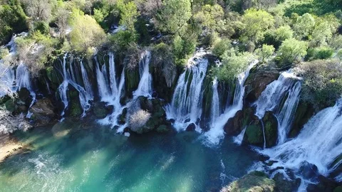 Aerial top view of an impressive waterfall in the background Stock Footage 74539110
