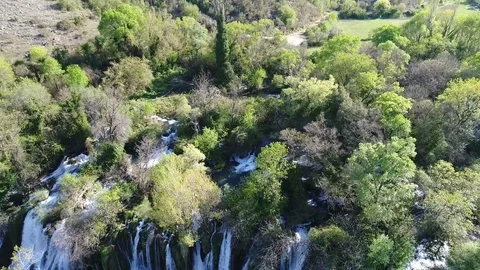 Aerial top view of an impressive waterfall in the background Stock Footage 74539241