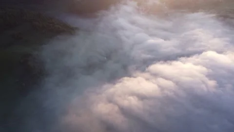Aerial top view of inverse cloud cover in the light of the morning sun, Misty 스톡 동영상 201165016