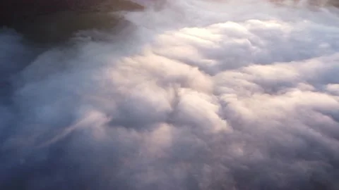 Aerial top view of inverse cloud cover in the light of the morning sun, Misty Stock Footage 201165258