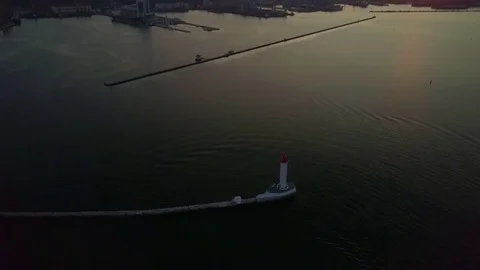 Aerial top view lighthouse at amazing bright colorful sunset drone footage Stock Footage