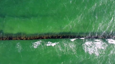 Aerial top view made by drone of a calm ... | Stock Video | Pond5