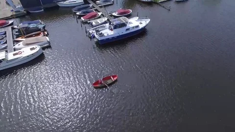 Aerial top of view of man rowing a row boat on the canal, Netherlands Stock Footage 84973390