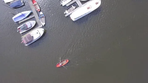 Aerial top of view of man rowing a row boat on the canal, Netherlands Stock Footage 85011219