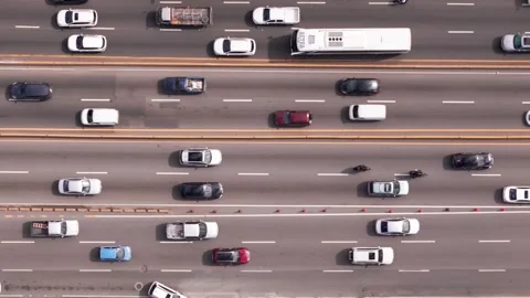 Aerial top view of multi-lane highway road with many slow driving cars Stock Footage 275185249