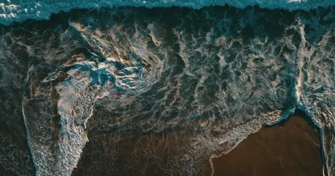 Aerial top view of ocean blue waves break on a beach. Sea waves and beautiful sa Stock Footage 121302827