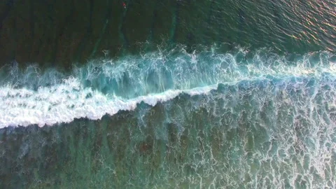 Aerial top view of ocean blue waves break on beautiful topical beach. Stock Footage 147607166