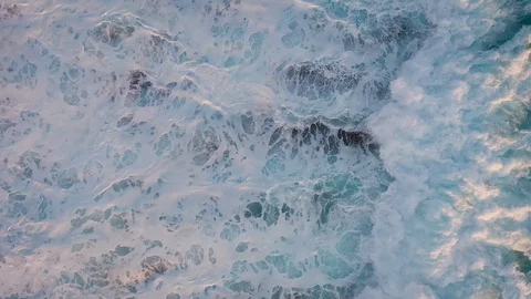 Aerial top view of ocean waves. Bird's eye view of sea water. Stock Footage 128826818