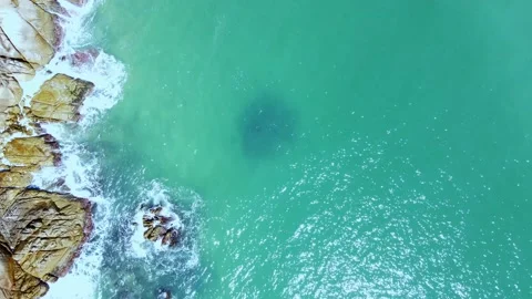 Aerial Top View of Ocean Waves Reaching Beach Shore. Drone Footage. Stock Footage 200778117