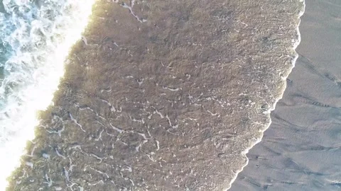 Aerial top view of ocean waves washing on sandy beach The Concept of Nature Stock-Footage 327953271