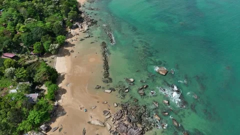 Aerial Top View of Ocean Waves Crashing on Sandy Beach with Rocks Stock Footage 331864326