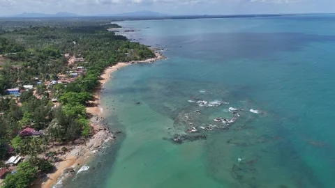 Aerial Top View of Ocean Waves Crashing on Sandy Beach with Rocks Stock Footage 331864329
