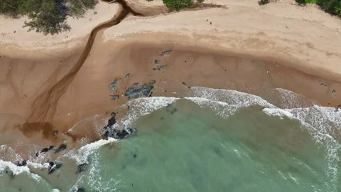 Aerial Top View of Ocean Waves Crashing on Sandy Beach with Rocks Stock Footage 331865746