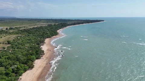 Aerial Top View of Ocean Waves Crashing on Sandy Beach with Rocks Stock Footage 331865849
