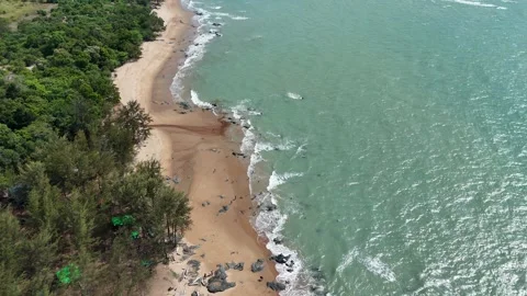 Aerial Top View of Ocean Waves Crashing on Sandy Beach with Rocks Stock Footage 331865881