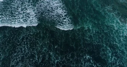 Aerial Top View of Ocean Waves Forming Patterns on Beach Stock-Footage 332145078