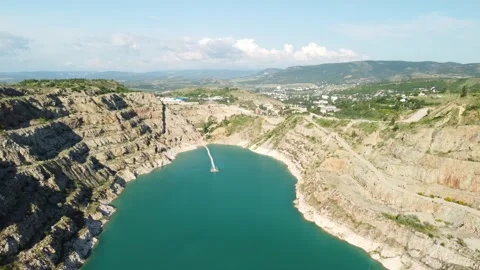 Aerial top view on opencast mining quarry with flooded bottom, turquoise surface Stock Footage 204068708