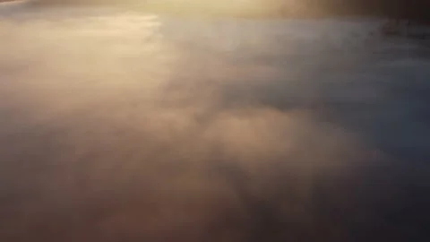 Aerial top view over the clouds, at sunrise	 Stock Footage 234418668