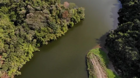 Aerial top view over river on spring season with mountain green jungle Stock Footage 107459369