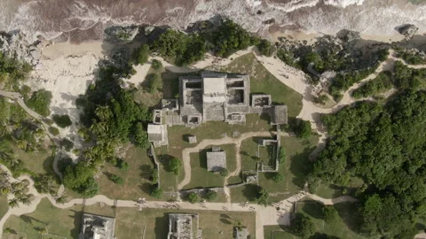 Aerial Top View Of People Exploring Tulum Ruins On Sunny Day, Drone Descending Stock Footage 152911087