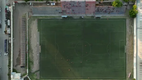 Aerial top view of people playing football in sports field Stock Footage 283765663