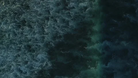 Aerial top view of powerful dark ocean waves crashing with white foam Stock Footage 305388452