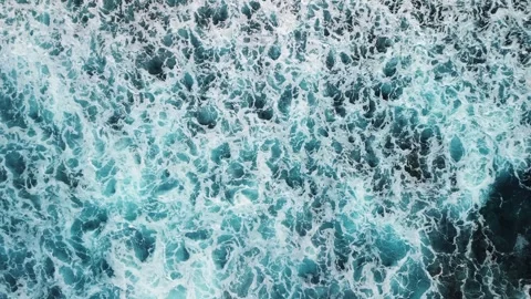 Aerial top view of powerful dark ocean waves crashing with white foam Stock Footage 305559973