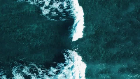 Aerial top view of powerful dark ocean waves crashing with white foam Stock Footage 305560451