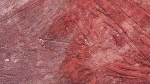 Aerial top view of red muck on construction site Stock Footage 234464706
