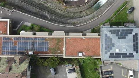 Aerial Top View of Residential Rooftops with Solar Panels in Urban Area Stockbeeldmateriaal 332854357