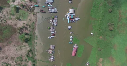Aerial top view of a river with floating houses and boats Stock Footage 61520096