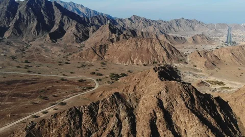 AERIAL. Top view of Road between mountains in UAE Stock Footage 101044429