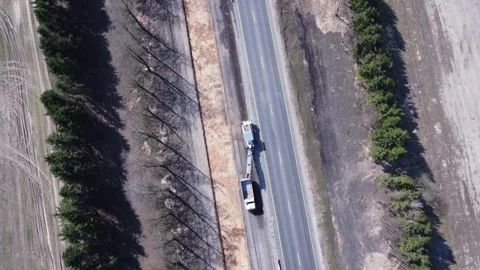 Aerial top view of road construction equipment, a dump truck, excavator Stock Footage 307604015
