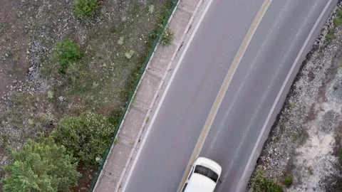 Aerial top view road going through green forest, view cars on road, traveling. Stock-Footage 239047885