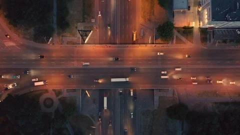 Aerial top view of the road junction in the city at night Stock Footage