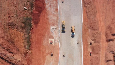Aerial top view of road rollers working on new road Видео 234895504