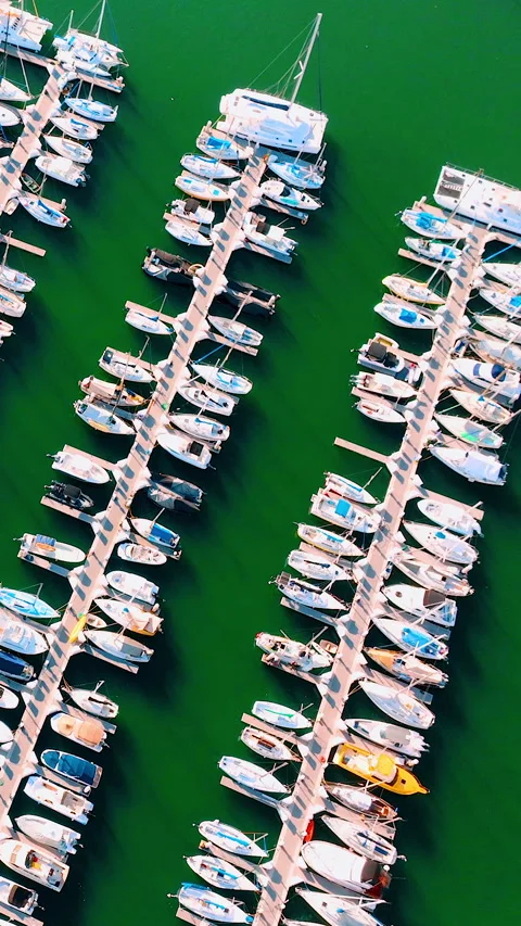 Aerial top view of rows of yachts and sailboats at the marina Stock Footage 307038902
