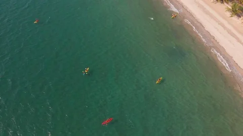 Aerial Top View of a Sandy Beach With Turquoise Water and visitor in kayaking Video stock 107152145