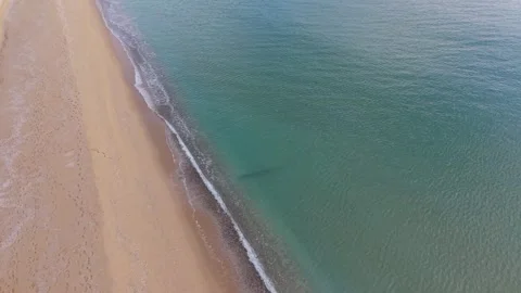 Aerial top view of sandy beach and turquoise ocean waves Stock Footage 327840238