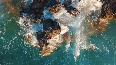 Aerial top view of sea wave hitting clif... | Stock Video | Pond5