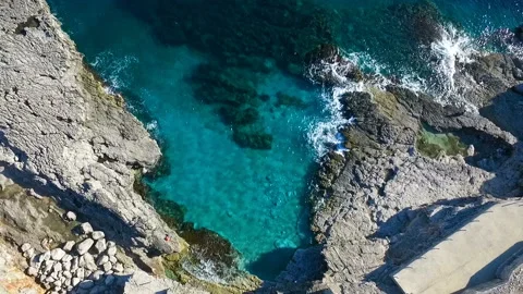 Aerial top view: sea waves wash the stones Stock Footage 111165724