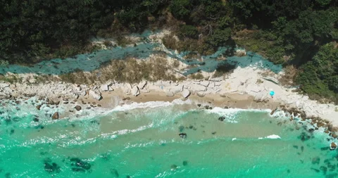 Aerial top view of the sea waves hitting the cliffs. Coastline beach with stones Stock Footage 201366418