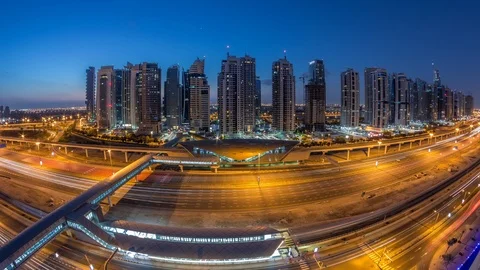 Aerial top view to Sheikh Zayed road near Dubai Marina and JLT night to day Stockbeeldmateriaal 117251599