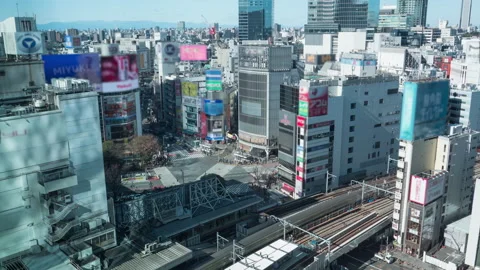 Aerial top view of Shibuya crossing. 4K Time lapse, blurred logos Stock Footage
