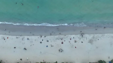 Aerial top view smooth waves hit the shore at Kata beach. Stock Footage 234368494