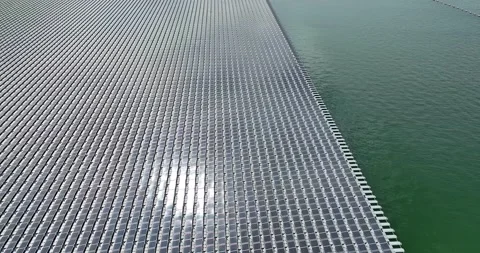 Aerial top view of solar panels or solar cells on buoy floating in lake sea Stock Footage 170656239